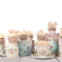 Pastel cupcakes in teacups